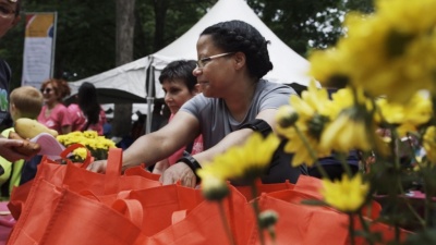 32_volunteer behind flowers.jpg